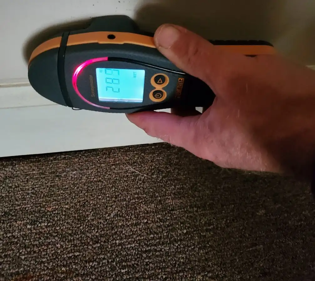 Moisture detection at baseboard during Storm Damage Restoration in Plaistow